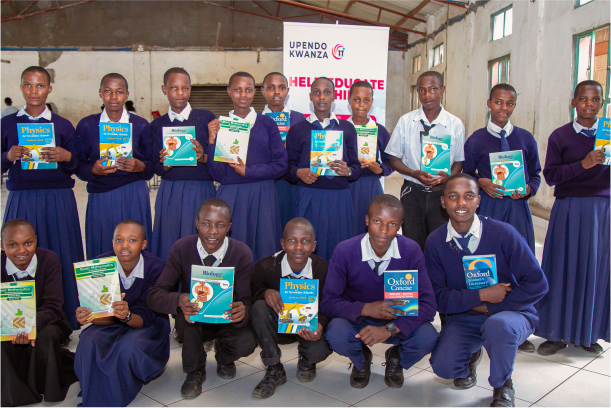 Group of students holding their new textbooks