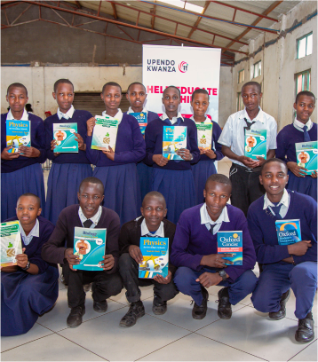 Group of students holding their new textbooks